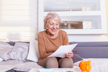 Thinking of Retiring in 2026? 4 Questions You Have to Ask First: https://g.foolcdn.com/editorial/images/841357/senior-woman-smiling-reading-document-gettyimages-1205215075.jpg