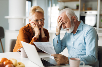 5 Required Minimum Distribution (RMD) Mistakes That Are Dangerously Easy to Make: https://g.foolcdn.com/editorial/images/841697/seniors-at-laptop-stressed-gettyimages-1305682673-1320x880-2aa171e.jpg