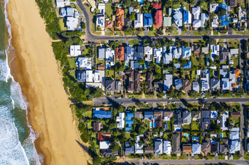 How Artificial Intelligence (AI) and Interest Rate Cuts Could Send This Under-the-Radar Stock Soaring: https://g.foolcdn.com/editorial/images/841595/an-aerial-photo-of-dozens-of-houses-and-the-beach-in-a-coastal-suburb.jpg