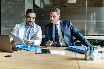 2 Top Stocks That Can Supercharge Your Portfolio in 2026 and Beyond: https://g.foolcdn.com/editorial/images/841007/businessperson-and-doctor-talking.jpg