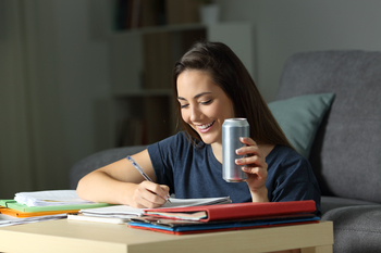 1 Growth Stock Down 30% to Buy Right Now: https://g.foolcdn.com/editorial/images/838805/lady-studies-in-a-home-setting-holding-a-beverage-can.jpg