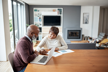 5 Things You Should Know Before Switching to a Medicare Advantage Plan: https://g.foolcdn.com/editorial/images/842166/older-couple-bills-personal-finance-investing.jpg