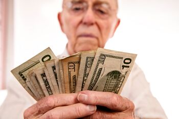 2 High-Yielding ETFs That Can Bankroll Your Retirement for Years: https://g.foolcdn.com/editorial/images/844152/person-holding-several-10-dollar-bills.jpg