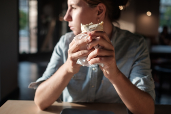Has Chipotle Mexican Grill (CMG) Stock Been Good for Investors?: https://g.foolcdn.com/editorial/images/843997/eating-a-burrito-973446448.jpg