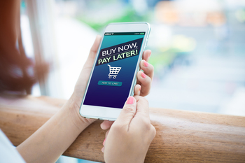 Is Affirm Stock Yesterday's News?: https://g.foolcdn.com/editorial/images/842963/checking-out-bnpl-smartphone.jpg
