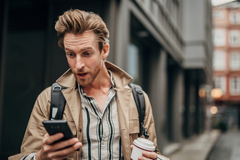 1 Top Cryptocurrency to Buy Before It Soars 180%, According to Tom Lee of Fundstrat: https://g.foolcdn.com/editorial/images/845248/surprised-person-using-phone-on-the-street-in-city.jpg