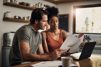 The 2026 Social Security COLA Is Final, but Retirees Need to Brace for This Big Blow: https://g.foolcdn.com/editorial/images/842925/couple-looking-at-financial-papers.jpg