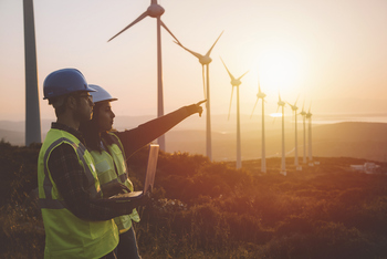 Utility Stocks Are Rebounding. Here Are 3 That Could Continue to Soar In 2026.: https://g.foolcdn.com/editorial/images/843088/people-holding-a-laptop-looking-at-wind-turbines.jpg
