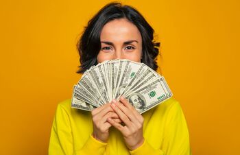 2 Top Vanguard ETFs That Can Turn $300 Each Month Into Over $1 Million: https://g.foolcdn.com/editorial/images/844845/person-holding-many-hundred-dollar-bills.jpg