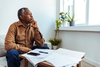 5 Signs You Shouldn't Retire in 2026: https://g.foolcdn.com/editorial/images/846238/thinking-person-looking-out-window.jpg