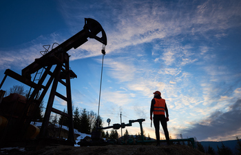 Why Chevron Could Thrive If Energy Prices Stay Elevated Through 2030: https://g.foolcdn.com/editorial/images/843460/the-silhouette-of-a-person-next-to-an-oil-well.jpg