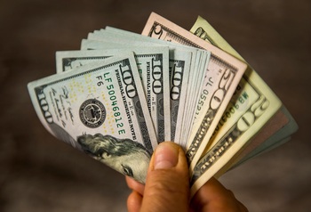 Cash vs. Dividend ETFs vs. Bond Funds: Why T-Bills Are My Favorite "Dry Powder" Right Now: https://g.foolcdn.com/editorial/images/848387/hand-holding-cash-dividends.jpg
