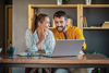 This Under-$10 Stock Is About to Go Parabolic: https://g.foolcdn.com/editorial/images/847917/two-happy-people-discussing-while-reading-on-a-laptop.jpg