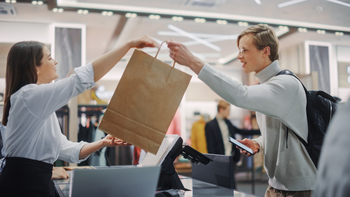 1 Stock I'd Buy Before TJX In 2026: https://g.foolcdn.com/editorial/images/846985/person-making-a-purchase-in-a-retail-store.jpg