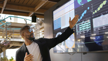 The Next Stock-Split Stock That Could Make You Rich: https://g.foolcdn.com/editorial/images/847916/analyst-pointing-at-visualizations-on-a-large-screen.jpg