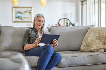 Netflix vs. Spotify: Which Streaming Giant Is Poised for a Comeback in 2026?: https://g.foolcdn.com/editorial/images/848745/gettyimages-woman-tablet-couch-straeming.jpg