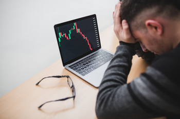 Is Lucid Group Stock Your Ticket to Becoming a Millionaire?: https://g.foolcdn.com/editorial/images/848539/23_11_28-a-person-covering-their-eyes-with-a-computer-image-of-a-falling-stock-graph-in-front-of-them-_mf-dloadgettyimages-1409300273-1200x800-5b2df79.jpg