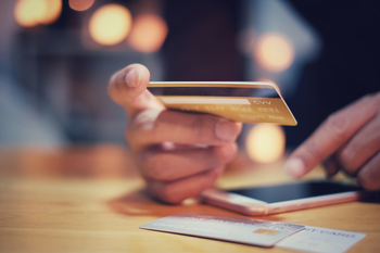 Should You Forget Upstart and Buy American Express Instead?: https://g.foolcdn.com/editorial/images/848875/using-credit-card-mobile-payment.jpg