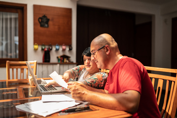4 Ways to Increase Your Future Social Security Benefit After an Early Claim: https://g.foolcdn.com/editorial/images/847191/reviewing-financial-paperwork.jpg