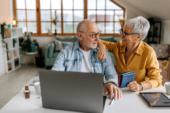 Ready to Tap Your Retirement Savings in 2026? 3 Questions to Ask Yourself First.: https://g.foolcdn.com/editorial/images/848470/senior-couple-laptop-gettyimages-1492831728.jpg