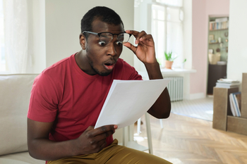 2 Dividend ETFs to Buy Hand Over Fist and 1 to Avoid: https://g.foolcdn.com/editorial/images/849187/25_03_08-a-person-looking-at-a-piece-of-paper-with-a-shocked-expression-_mf-dload-gettyimages-997934518-1200x800-5b2df79.jpg