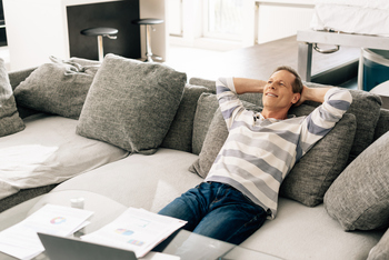 Investing $50,000 in Each of These 5 Stocks Could Make You Over $20,600 in Passive Income in 2026: https://g.foolcdn.com/editorial/images/849484/person-on-couch-with-hands-behind-head.jpg