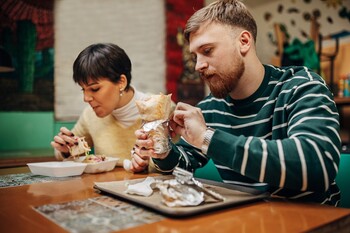 The Untapped Revenue Stream That Could Transform Chipotle's Growth Story: https://g.foolcdn.com/editorial/images/849652/couple-two-people-eat-burrito-chipotle.jpg