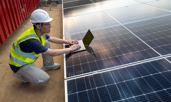 Why First Solar Stock Dimmed by More than 10% Today: https://g.foolcdn.com/editorial/images/849925/person-using-a-laptop-on-top-of-a-solar-panel.jpg