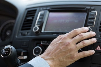Should You Forget Sirius XM? This Stock Has Made Far More Millionaires.: https://g.foolcdn.com/editorial/images/850351/hand-on-car-entertainment-system.jpg
