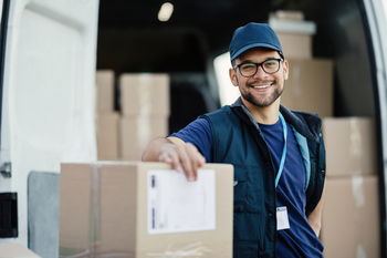 UPS in 2025, and How It's Shaping Up for 2026: https://g.foolcdn.com/editorial/images/851033/getty-smiling-worker-next-to-boxes-1200x800-5b2df79.jpg