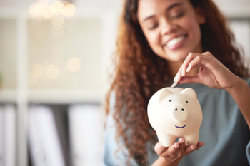 Why Investors Kept Banking on JPMorgan Chase Stock in 2025: https://g.foolcdn.com/editorial/images/851242/person-stuffing-money-into-a-piggy-bank-and-smiling.jpg