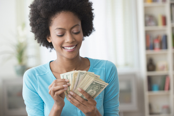 Better Buy: The Vanguard S&P 500 ETF or This Magnificent Alternative?: https://g.foolcdn.com/editorial/images/851320/young-person-holding-cash-money.jpg