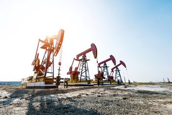 1 Magnificent Oil Stock Down 15% to Buy and Hold Forever for Its Dividend: https://g.foolcdn.com/editorial/images/850513/oil-derricks-in-the-desert.jpg