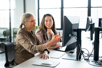 3 No-Brainer AI Stocks to Buy Hand Over Fist for 2026: https://g.foolcdn.com/editorial/images/851457/two_professionals_smiling_while_discussing_something_on_a_desktop_monitor.jpg