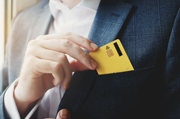 Is 2026 the Year to Buy American Express Stock?: https://g.foolcdn.com/editorial/images/851069/pulling-credit-card-from-front-jacket-pocket.jpg