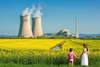 Why Nano Nuclear Energy Stock Popped Wednesday: https://g.foolcdn.com/editorial/images/852251/mother-and-son-hold-hands-in-a-field-of-flowers-outside-a-nuclear-power-station.jpg