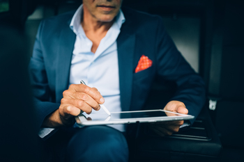 1 Glorious Growth Stock Down 81% to Buy on the Dip in January: https://g.foolcdn.com/editorial/images/851966/a-person-in-a-car-signing-a-digital-tablet.jpg