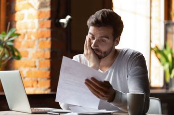 The S&P 500 Hasn't Been This Expensive Since the Early 2000s. Is a Crash Inevitable in 2026?: https://g.foolcdn.com/editorial/images/851794/concerned-person-looking-at-a-piece-of-paper.jpg