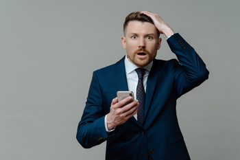 Prediction: XRP Will Hit $4 in 2026: https://g.foolcdn.com/editorial/images/851047/investor-in-suit-holding-smartphone.jpg