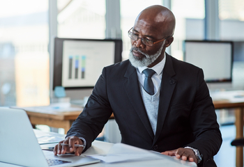 A New 401(k) Restriction Could Lead to a Bigger Tax Bill for These Workers: https://g.foolcdn.com/editorial/images/852581/getty-person-in-suit-at-desk-laptop-thoughtful-thinking-1286x880-7c61f58.jpg