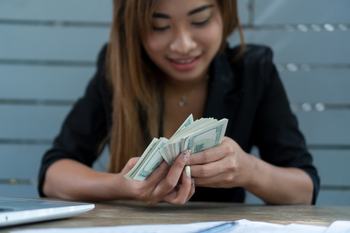 UPS Plans to Continue Delivering its 6%-Yielding Dividend in 2026: https://g.foolcdn.com/editorial/images/853126/counting-money-dollar-bills-1200x800-5b2df79.jpg