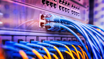3 Reasons Why Broadcom Could Be the Most Underrated Dividend Growth Stock to Buy in 2026: https://g.foolcdn.com/editorial/images/852899/computer-cables-are-connected-to-a-networking-device.jpg
