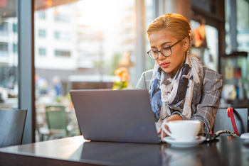 Getting a Tax Refund in 2026? Here's the Best Thing to Do With It.: https://g.foolcdn.com/editorial/images/852877/woman-20s-laptop-serious-at-coffee-bar-gettyimages-1411266809.jpg