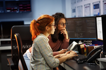 2 Under-the-Radar Artificial Intelligence (AI) Stocks to Watch Closely in February: https://g.foolcdn.com/editorial/images/853105/two-computer-programmers-working-together-while-looking-at-computer-screens.jpg