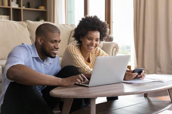 2 Financial Stocks Poised for a Comeback in 2026: https://g.foolcdn.com/editorial/images/850295/two-people-smile-as-they-engage-in-financial-planning-in-a-living-room.jpg