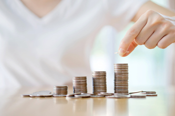 Energy Transfer Continues to Boost its More Than 7%-Yielding Dividend: https://g.foolcdn.com/editorial/images/853549/a-person-putting-coins-on-steadily-rising-stacks.jpg