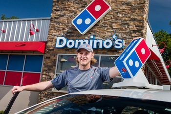 I Predicted That Coca-Cola Would Be a Better Buffett Stock Than Domino's to Buy in 2025. Here's What Happened.: https://g.foolcdn.com/editorial/images/853335/dominos-delivery-person.jpg