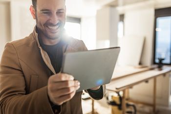 This Dirt Cheap Stock Is Expected to Quadruple Its Earnings This Year: https://g.foolcdn.com/editorial/images/853510/person-smiling-while-looking-at-a-tablet.jpg