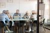 Why ServiceNow Stock Bumped Higher on Monday: https://g.foolcdn.com/editorial/images/854280/a-group-of-people-gathered-around-a-table-in-an-office.jpg