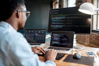 Forget SoundHound AI: This Enterprise AI Name With Deep Government Roots Is the Safer 10X Shot: https://g.foolcdn.com/editorial/images/852430/software-programmer-coding-a-program.jpg